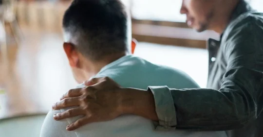 Family members talking to one another, codependency and family dynamics in addiction.
