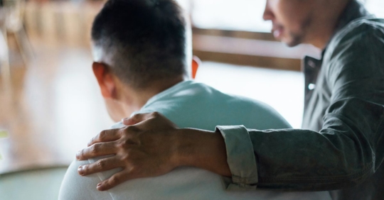 Family members talking to one another, codependency and family dynamics in addiction.