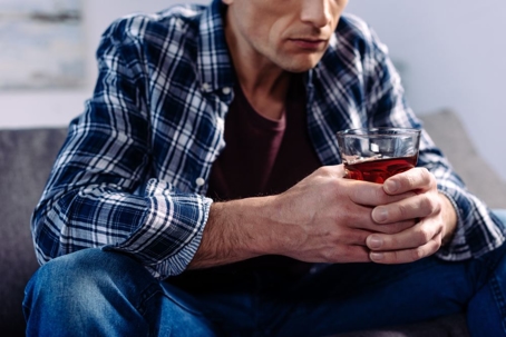 man drinking alcohol