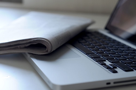 newspaper and computer